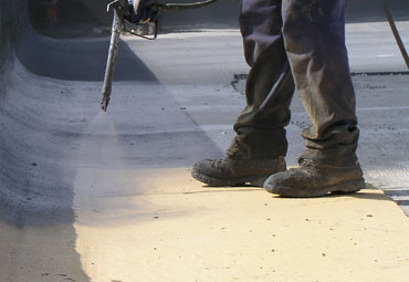 Coating systems over Dover spray foam roof systems